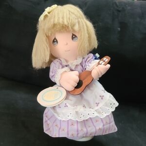 Precious Moments Cream and Purple Doll with Musical Accessory